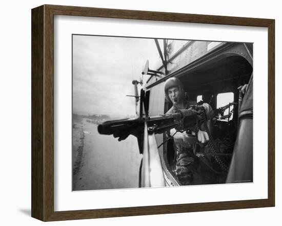 Crew Chief Lance Cpl. James C. Farley Manning Helicopter Machine Gun of Yankee Papa 13-Larry Burrows-Framed Premium Photographic Print