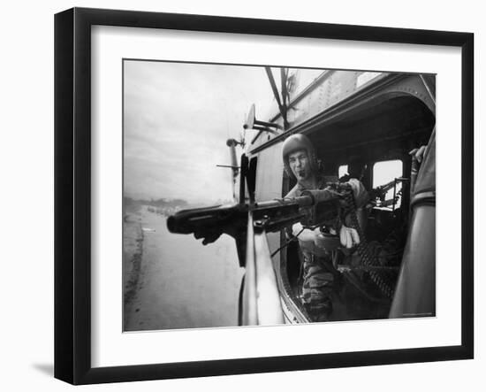 Crew Chief Lance Cpl. James C. Farley Manning Helicopter Machine Gun of Yankee Papa 13-Larry Burrows-Framed Photographic Print