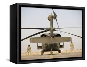 Crew Chiefs Stand Beside their UH-60L Black Hawk Helicopter-null-Framed Stretched Canvas