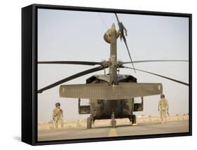 Crew Chiefs Stand Beside their UH-60L Black Hawk Helicopter-null-Framed Stretched Canvas