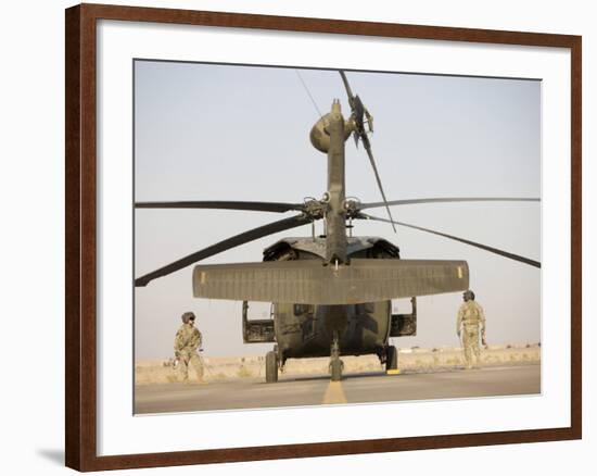 Crew Chiefs Stand Beside their UH-60L Black Hawk Helicopter-null-Framed Photographic Print