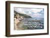 Croatia, Dubrovnik. View of marina and coastline from old city wall. Fisherman stands on shore.-Trish Drury-Framed Photographic Print