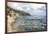 Croatia, Dubrovnik. View of marina and coastline from old city wall. Fisherman stands on shore.-Trish Drury-Framed Photographic Print