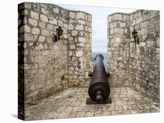 Croatia, Hvar. Cannon overlooking the town and coastline from Hvar Fortica or Spanjola Fortress.-Julie Eggers-Stretched Canvas