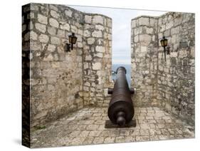 Croatia, Hvar. Cannon overlooking the town and coastline from Hvar Fortica or Spanjola Fortress.-Julie Eggers-Stretched Canvas