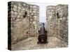 Croatia, Hvar. Cannon overlooking the town and coastline from Hvar Fortica or Spanjola Fortress.-Julie Eggers-Stretched Canvas