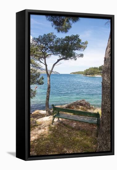 Croatia, Hvar Island, Stari Grad. Picturesque waterfront spot for bench.-Trish Drury-Framed Stretched Canvas