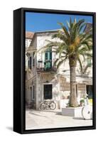 Croatia, Hvar Island, Stari Grad. Uncrowded. Bicycle parked at cafe.-Trish Drury-Framed Stretched Canvas