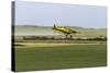 Crop Duster Airplane Spraying Farm Field Near Mott, North Dakota, USA-Chuck Haney-Stretched Canvas