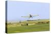 Crop Duster Airplane Spraying Farm Field Near Mott, North Dakota, USA-Chuck Haney-Stretched Canvas