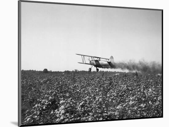 Crop Dusting Plane Flies over Field-null-Mounted Photographic Print