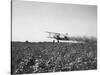 Crop Dusting Plane Flies over Field-null-Stretched Canvas