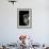 Cropped Portrait of a Man with Hat Starring into the Camera-Torsten Richter-Framed Photographic Print displayed on a wall