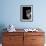 Cropped Portrait of a Man with Hat Starring into the Camera-Torsten Richter-Framed Photographic Print displayed on a wall