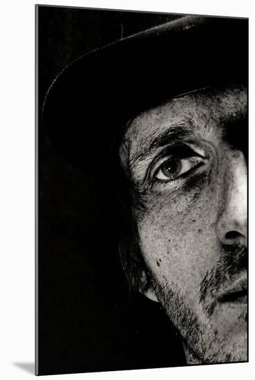 Cropped Portrait of a Man with Hat Starring into the Camera-Torsten Richter-Mounted Photographic Print