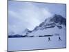 Cross Country Skiers by a Mountain-null-Mounted Photographic Print