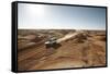 cross country vehicle between the opal mines in Coober Pedy, outback Australia-Rasmus Kaessmann-Framed Stretched Canvas