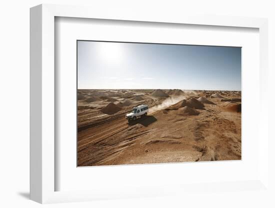 cross country vehicle between the opal mines in Coober Pedy, outback Australia-Rasmus Kaessmann-Framed Photographic Print