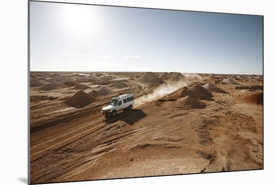 cross country vehicle between the opal mines in Coober Pedy, outback Australia-Rasmus Kaessmann-Mounted Photographic Print