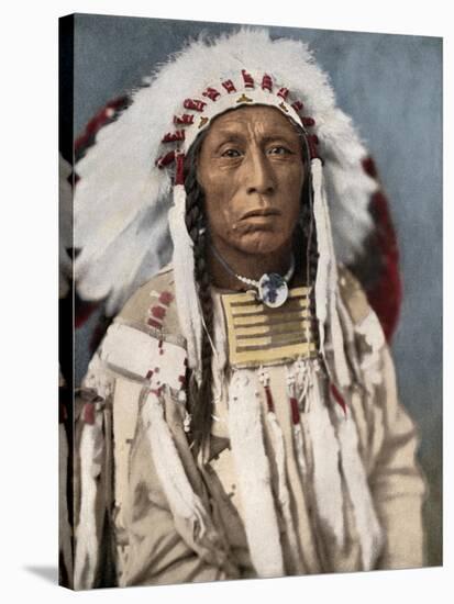Crow Indian Chief in a Traditional War Bonnet and Clothing, circa 1900-null-Stretched Canvas