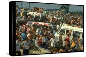 Crowd of people, some Sitting on Top of Cars and Busses, During the Woodstock Music/Art Fair-John Dominis-Stretched Canvas