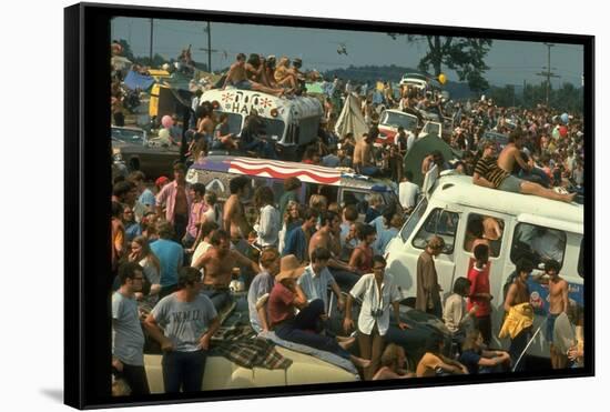 Crowd of people, some Sitting on Top of Cars and Busses, During the Woodstock Music/Art Fair-John Dominis-Framed Stretched Canvas
