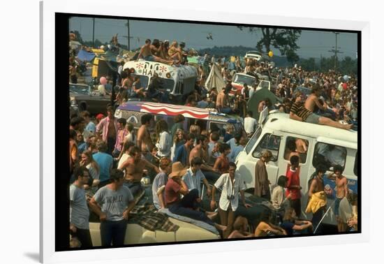 Crowd of people, some Sitting on Top of Cars and Busses, During the Woodstock Music/Art Fair-John Dominis-Framed Photographic Print