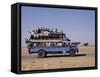 Crowded Bedford Bus Travels Along Main Road from Khartoum to Shendi, Old Market Town on Nile River-Nigel Pavitt-Framed Stretched Canvas