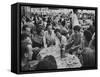 Crowded Outdoor Cafe in Rapallo, People Seated around Small Tables, Waiter Passing Through-null-Framed Stretched Canvas