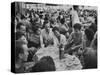 Crowded Outdoor Cafe in Rapallo, People Seated around Small Tables, Waiter Passing Through-null-Stretched Canvas