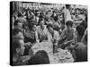 Crowded Outdoor Cafe in Rapallo, People Seated around Small Tables, Waiter Passing Through-null-Stretched Canvas