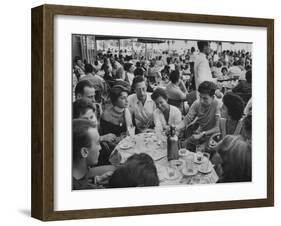 Crowded Outdoor Cafe in Rapallo, People Seated around Small Tables, Waiter Passing Through-null-Framed Photographic Print