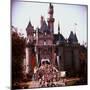 Crowds Walking Through Gate of Sleeping Beauty's Castle at Walt Disney's Theme Park, Disneyland-Allan Grant-Mounted Photographic Print