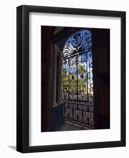 Cuba, Camaguey, UNESCO World Heritage Site, wrought iron grill in giant window of colonial mansion-Merrill Images-Framed Photographic Print