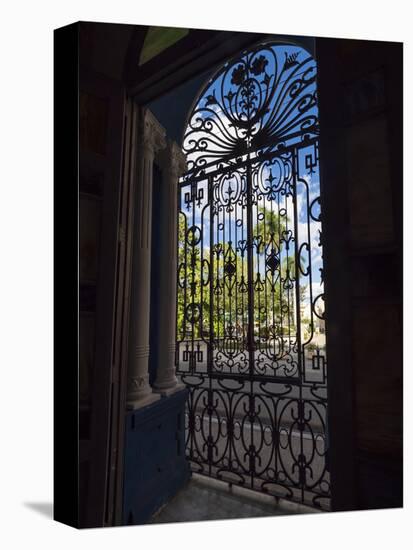 Cuba, Camaguey, UNESCO World Heritage Site, wrought iron grill in giant window of colonial mansion-Merrill Images-Stretched Canvas