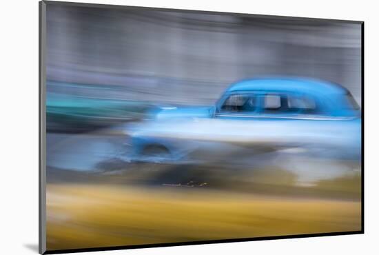 Cuba, Havana. Classic cars speed by in a blur along the streets of the city.-Brenda Tharp-Mounted Photographic Print