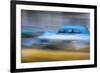 Cuba, Havana. Classic cars speed by in a blur along the streets of the city.-Brenda Tharp-Framed Premium Photographic Print