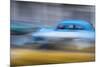 Cuba, Havana. Classic cars speed by in a blur along the streets of the city.-Brenda Tharp-Mounted Premium Photographic Print