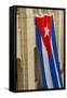 Cuba. Havana. Giant Cuban Flag Hanging in an Interior Courtyard-Inger Hogstrom-Framed Stretched Canvas