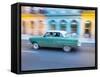 Cuba, Havana, Havana Vieja, UNESCO World Heritage Site, classic car in motion-Merrill Images-Framed Stretched Canvas