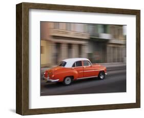 Cuba, Havana, Havana Vieja, UNESCO World Heritage Site, classic red car in motion-Merrill Images-Framed Photographic Print