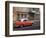 Cuba, Havana, Havana Vieja, UNESCO World Heritage Site, classic red car in motion-Merrill Images-Framed Photographic Print