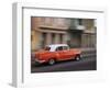 Cuba, Havana, Havana Vieja, UNESCO World Heritage Site, classic red car in motion-Merrill Images-Framed Photographic Print