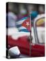 Cuba, Havana, Havana Vieja (UNESCO World Heritage Site), red classic convertible with Cuban flag.-Merrill Images-Stretched Canvas