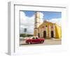 Cuba, Remedios, classic red car in front of Cathedral.-Merrill Images-Framed Photographic Print