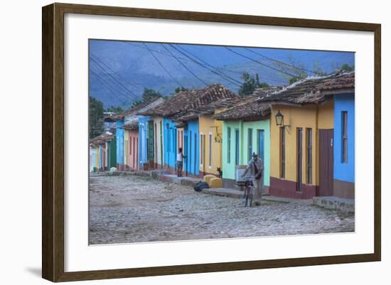 Cuba, Trinidad, a Man Selling Sandwiches Up a Colourful Street in Historical Center-Jane Sweeney-Framed Photographic Print