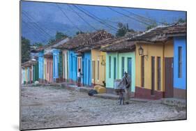 Cuba, Trinidad, a Man Selling Sandwiches Up a Colourful Street in Historical Center-Jane Sweeney-Mounted Photographic Print