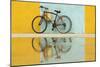 Cuba, Trinidad. Bicycle and reflection against yellow and blue walls.-Brenda Tharp-Mounted Photographic Print