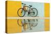 Cuba, Trinidad. Bicycle and reflection against yellow and blue walls.-Brenda Tharp-Stretched Canvas
