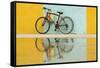 Cuba, Trinidad. Bicycle and reflection against yellow and blue walls.-Brenda Tharp-Framed Stretched Canvas